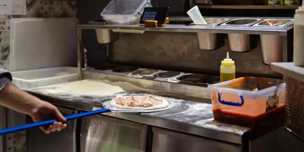 Getting ready to place tasty Italian pizza in the oven