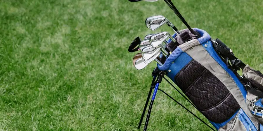 Golf Bag With Clubs At Golf Course