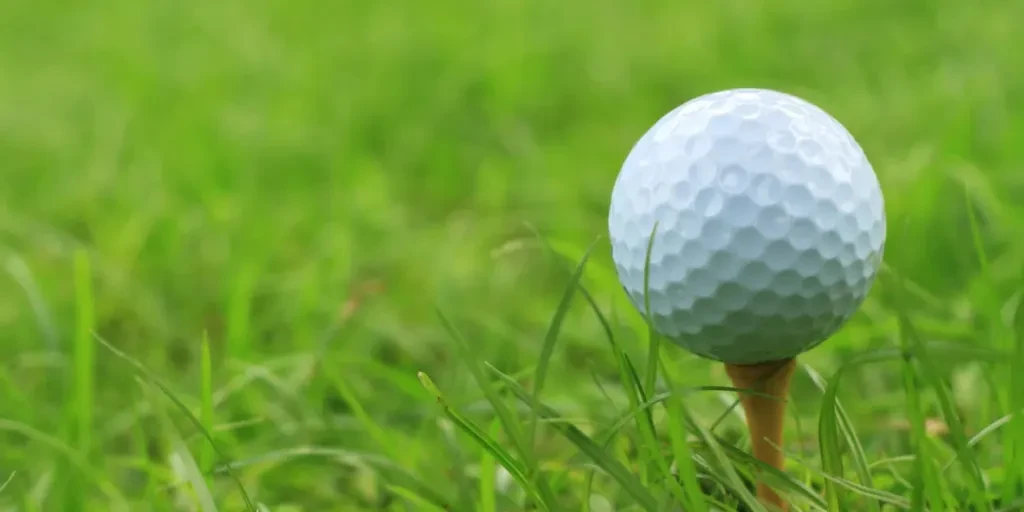 Golf ball on a tee peg