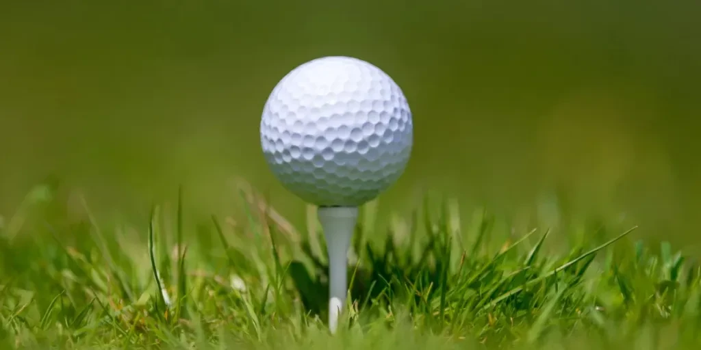 Golf ball on tee ready to be shot