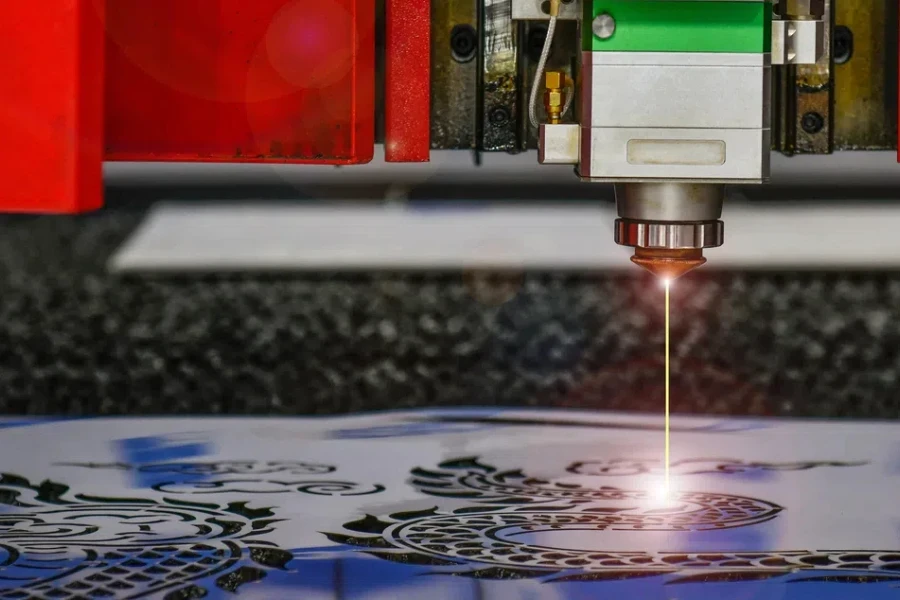 Industrial laser cut machine while cutting the sheet metal with the sparking light