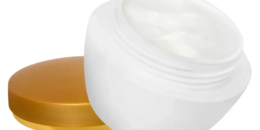 Jar with a cream on a white background