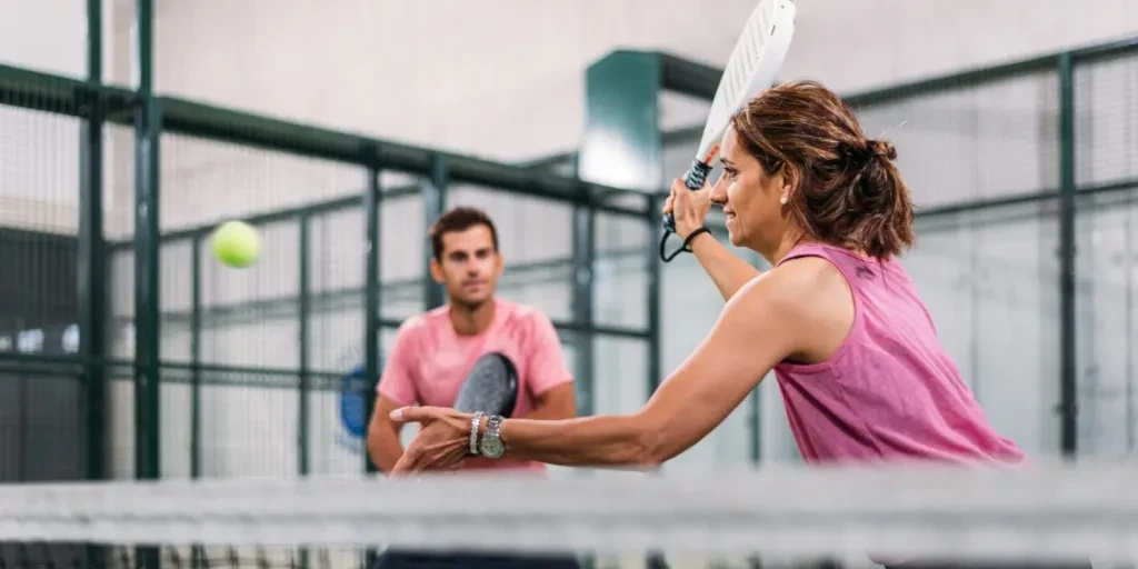 Mixed padel match on an indoor padel court