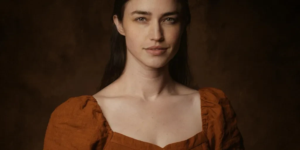 Stunning studio portrait of a woman in a brown medieval-style gown with lace details by Lance Reis