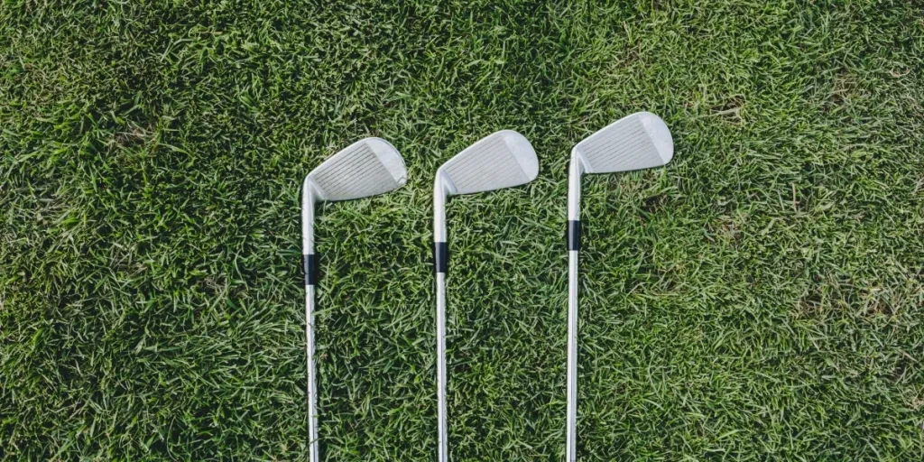 Three Golf Clubs On Green