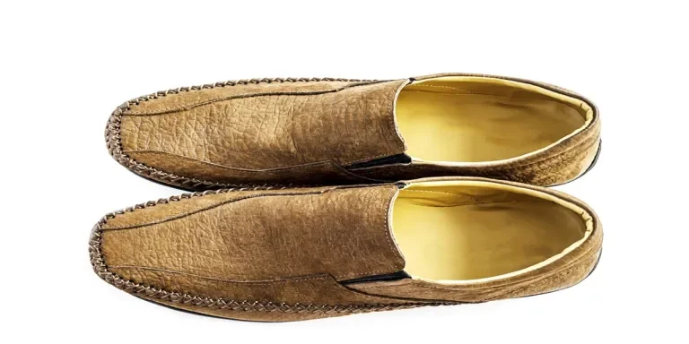 Top view of new brown leather fashion shoe for man isolated over white