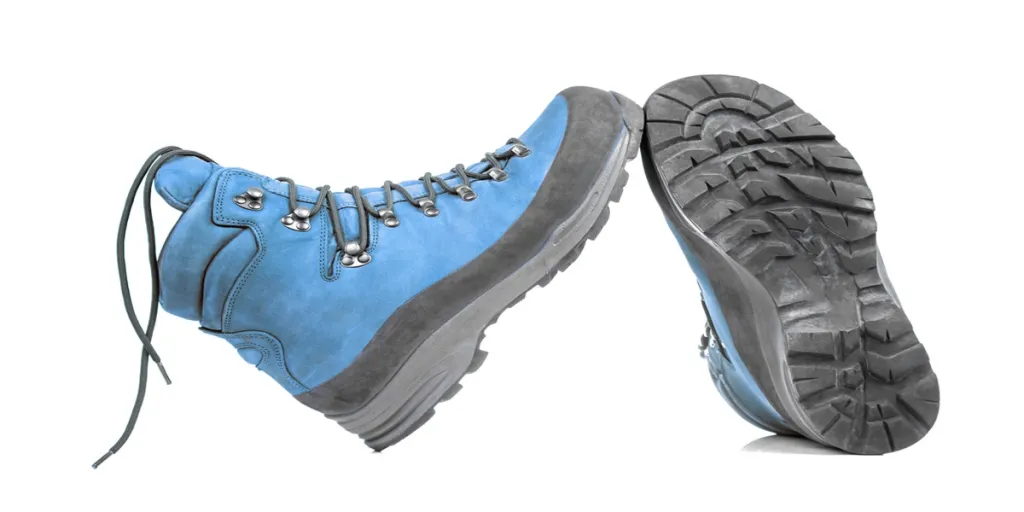 Trekking boots for hiking on a white background