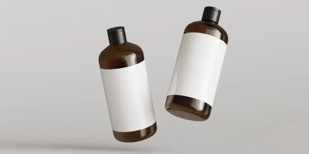 Two brown plastic cosmetic containers with labels