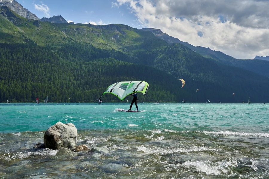 Wing surfing and kite boarding on the lake. Lots of water sports and athletes on Lake Silvaplana