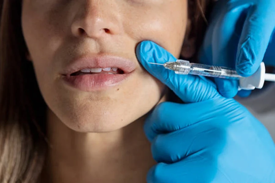 Woman getting dermal fillers injected near upper lip