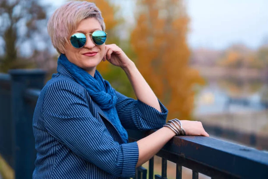 Woman on bridge with short blond Karen haircut