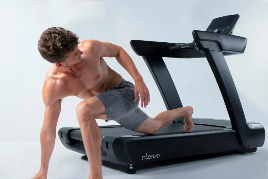 Young, fit yoga instructor poses on Intenza 450 Series Treadmill