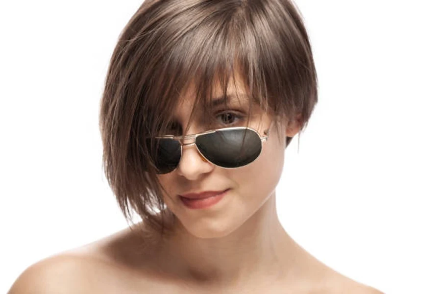 Young woman with brown Karen haircut and sunglasses