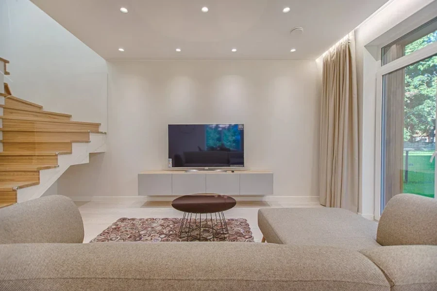 A flat screen TV in a large living room