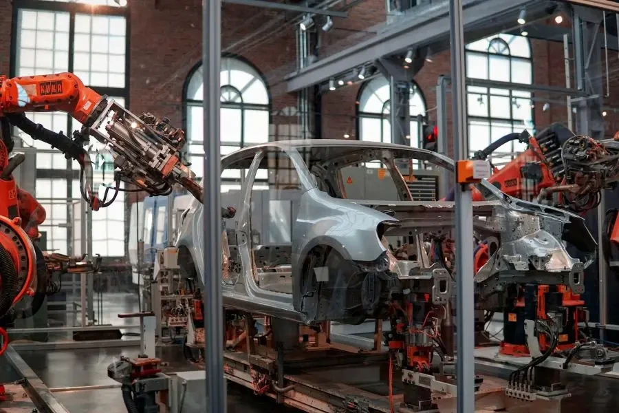 A robot fixing a car inside a factory