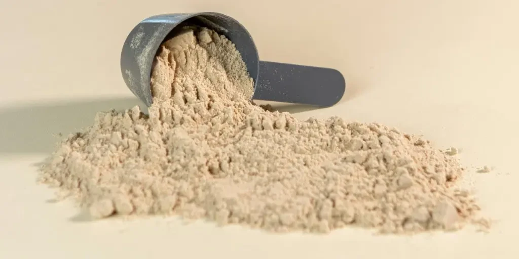 a scoop of powder sitting on top of a table