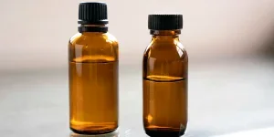 amber glass bottles on natural background
