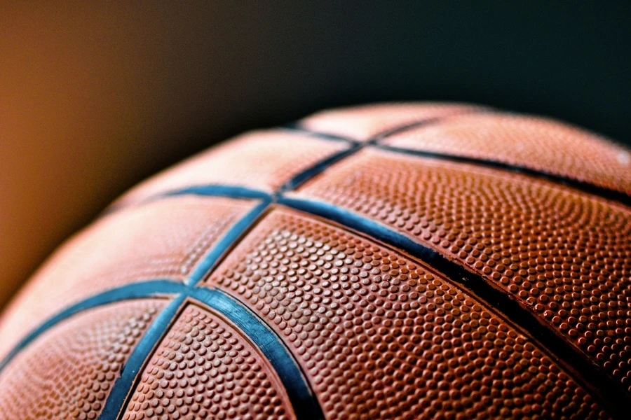 brown and black basketball ball