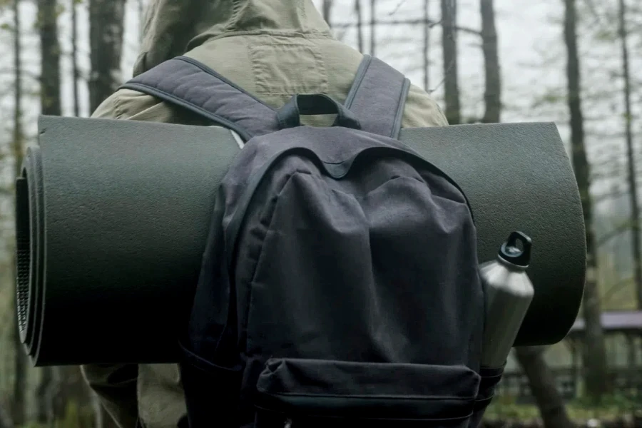 close-up of a hiker's backpack in a forest