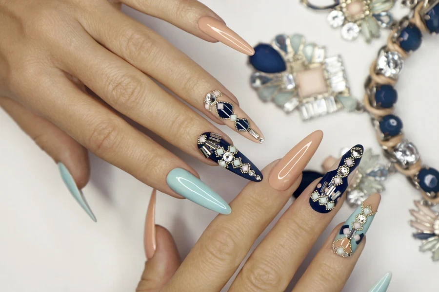 fake nails with a bejeweled design