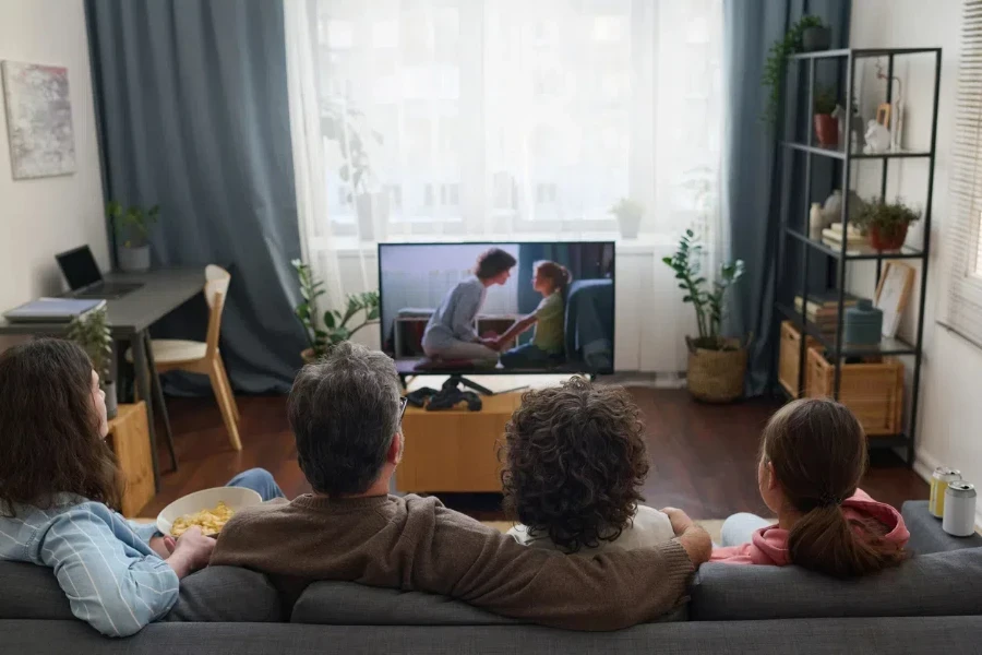 Family enjoying a movie together comfortably