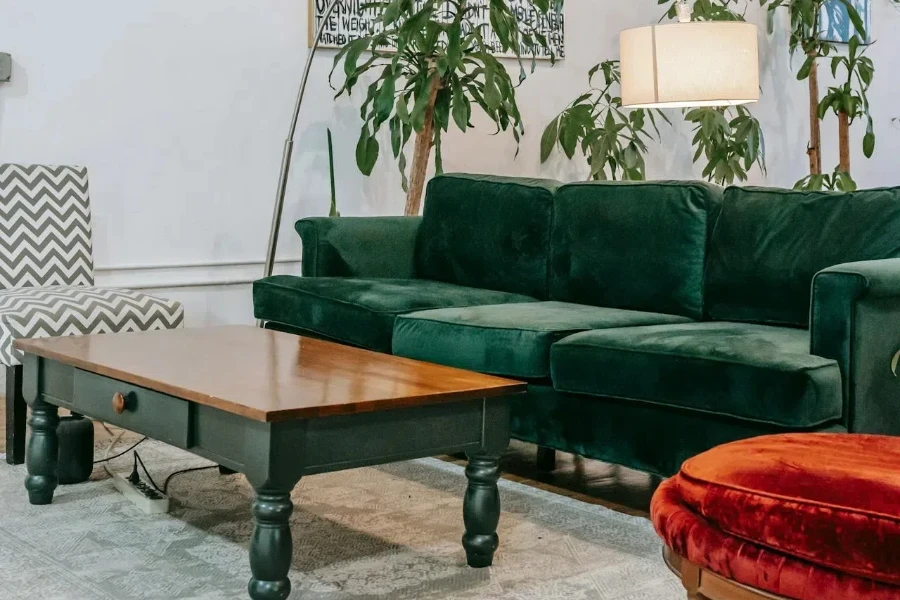 Green comfy velvet sofa in a living room