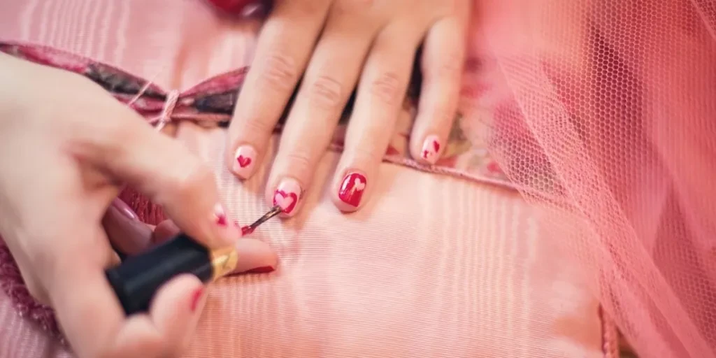 painting fingernails, nail polish, hearts