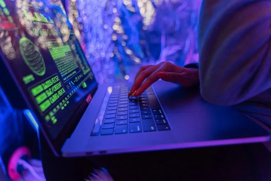 Person using black laptop computer