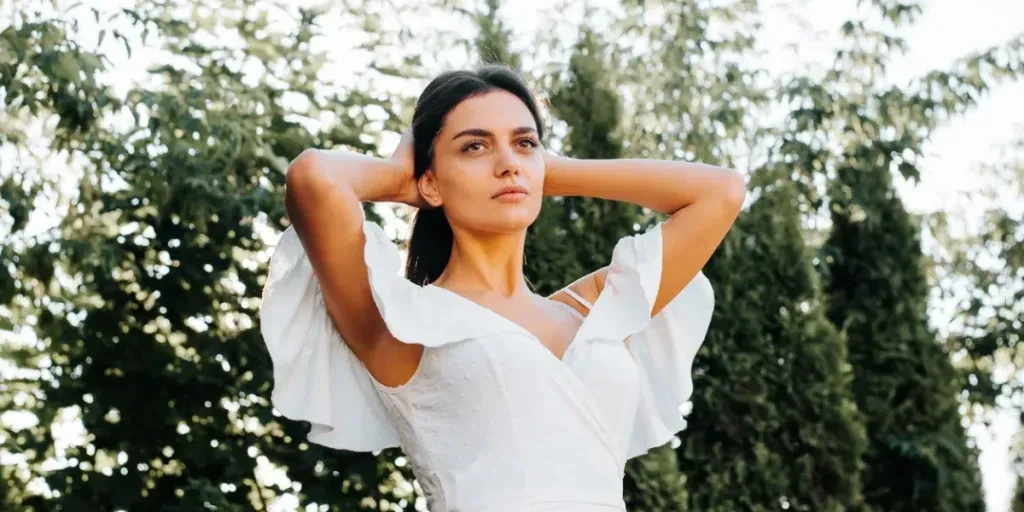 pretty mixed race model in white summer dress