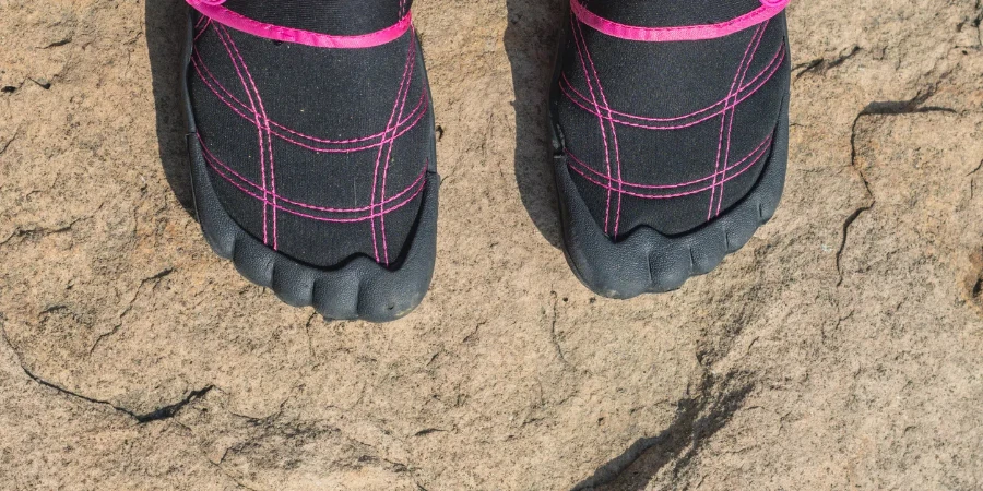 selective focus background image of water shoes on a rock surface