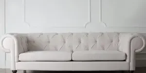 White upholstered sofa in a living room