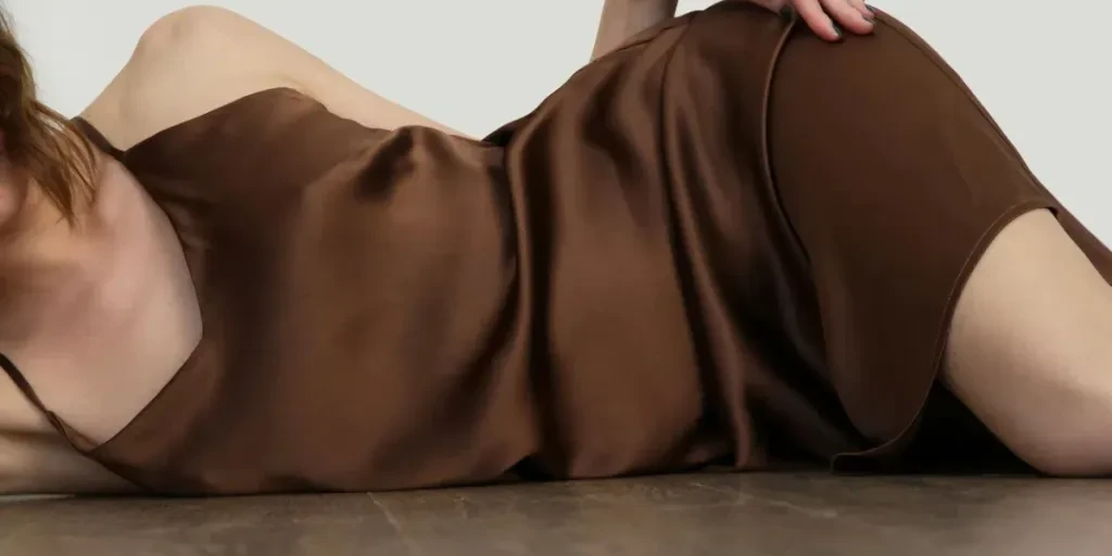 woman in brown silk satin camisole dress