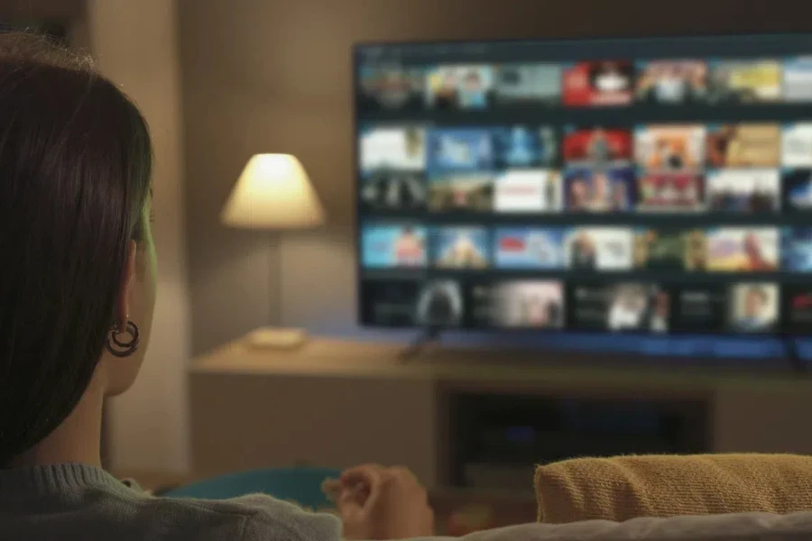 Woman watching TV in her living room