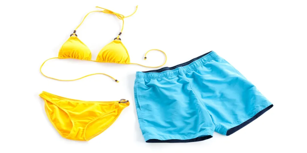 yellow bikini and blue beach short isolated on white