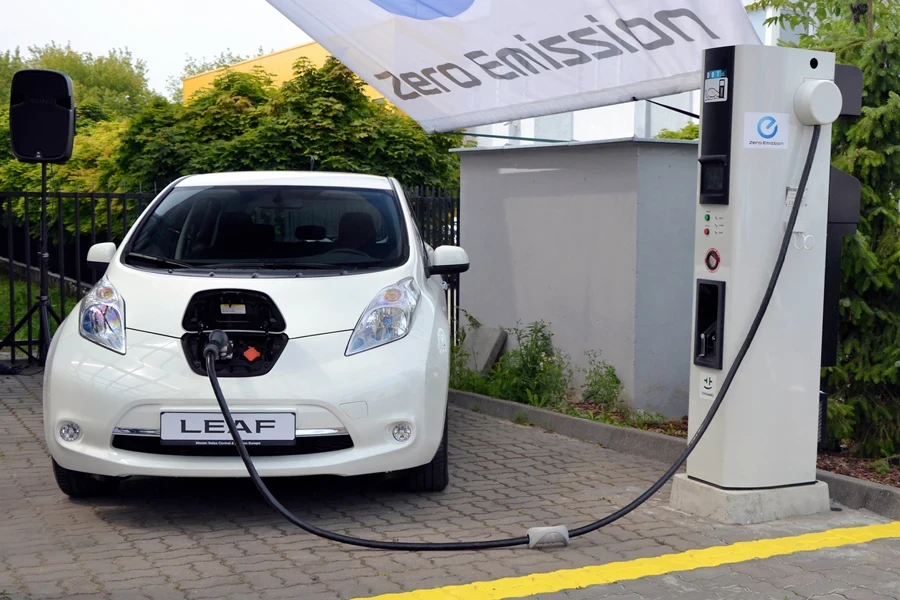 A Nissan Leaf on an electric charging point