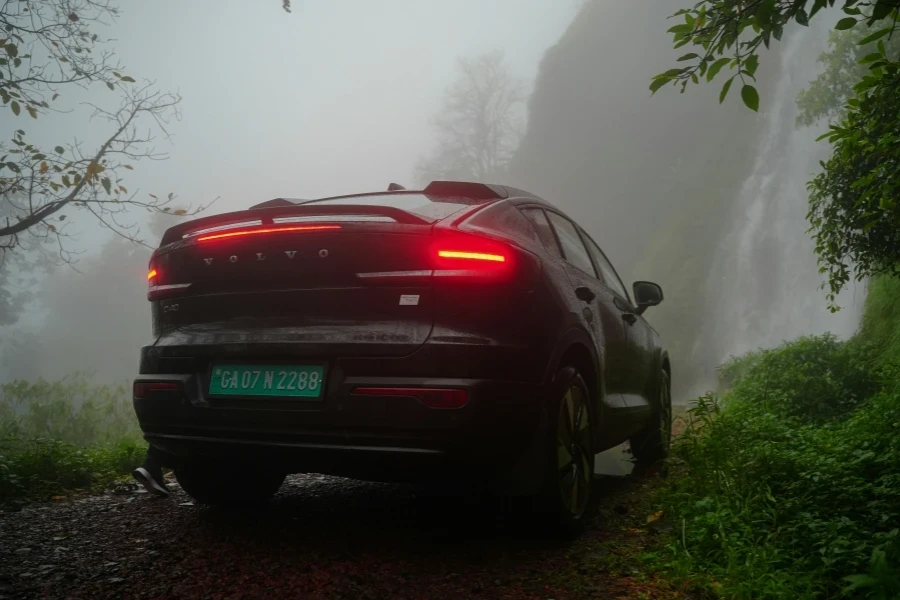 A Volvo C40 Recharge on a dirt road