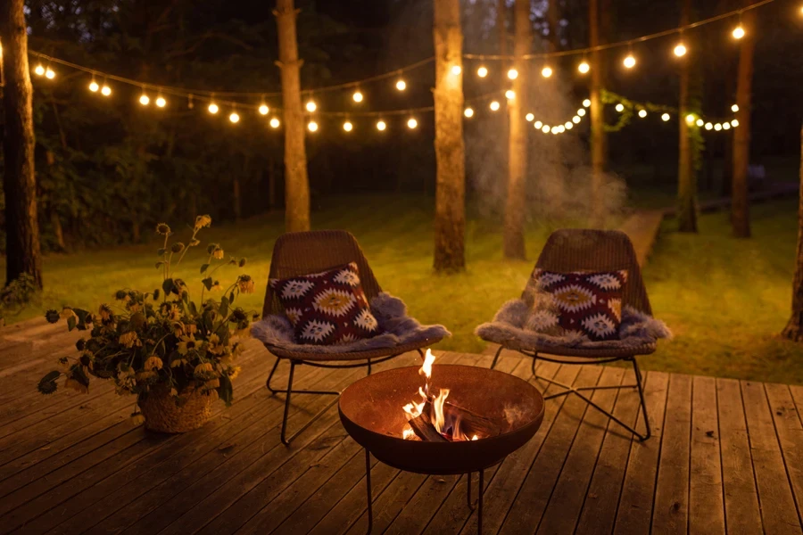 A cozy outdoor space surrounded by bug lights