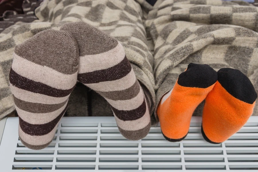 Adult and child wearing different patterns of regular socks