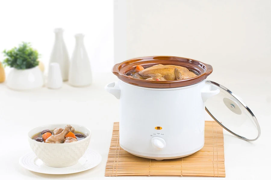 Chicken cooking in a small crock pot