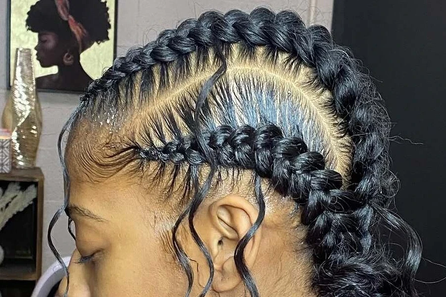 Close-up image of a woman with butterfly braids