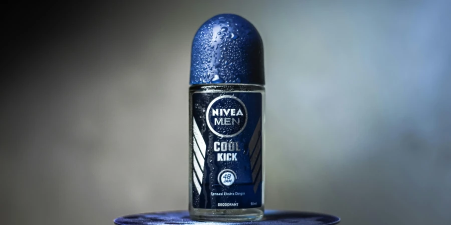 Close-up of Nivea Men Cool Kick deodorant with water droplets on a blurred background