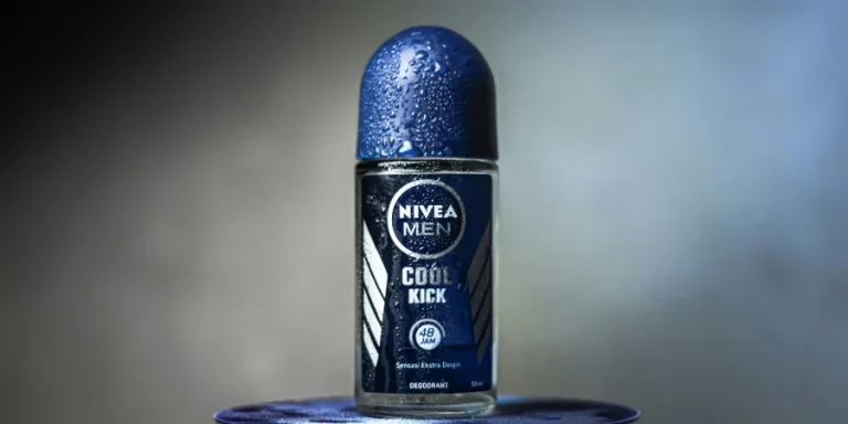 Close-up of Nivea Men Cool Kick deodorant with water droplets on a blurred background