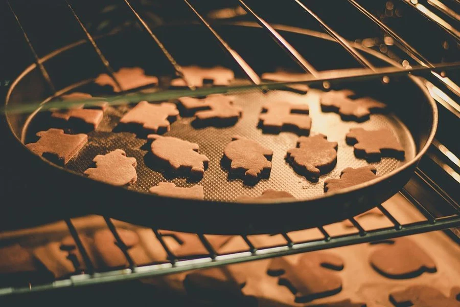 Gingerbread cookies baking in an oven