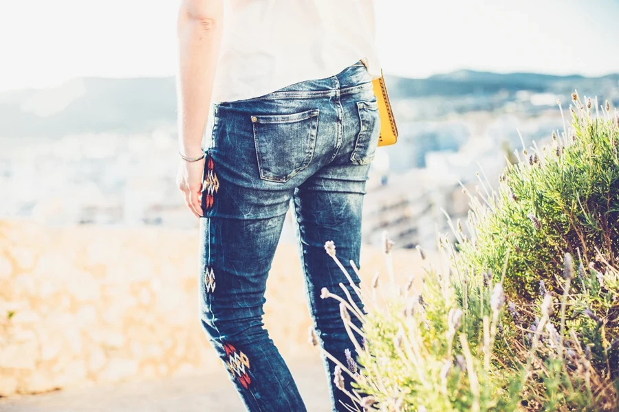 Rear view of a woman in slim straight-leg jeans