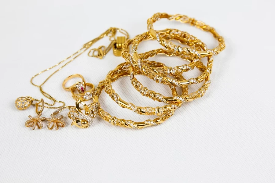 Selection of gold bracelets, rings, and a necklace