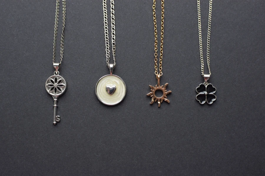 Selection of necklaces with one black clover design