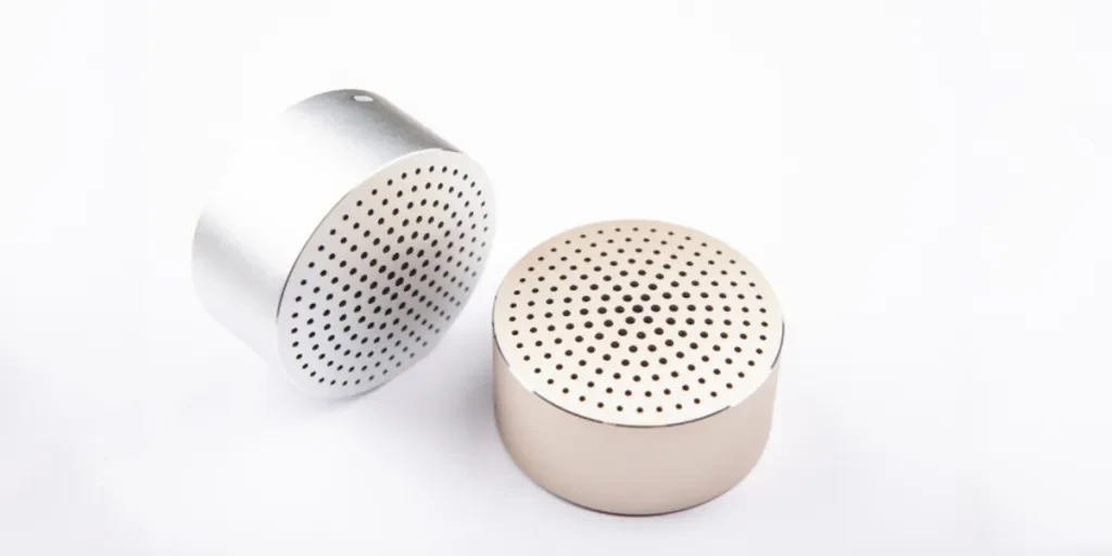 Two Bluetooth shower speakers on a white background