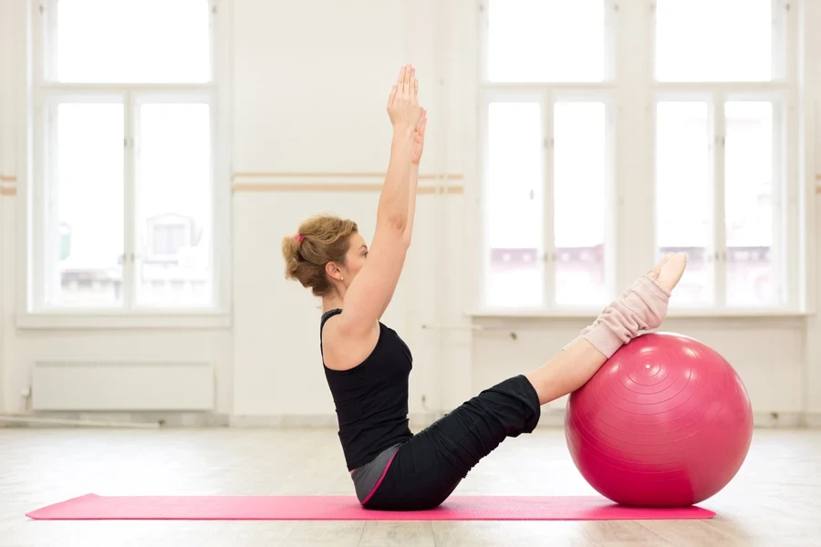 Woman doing pilates in a gym