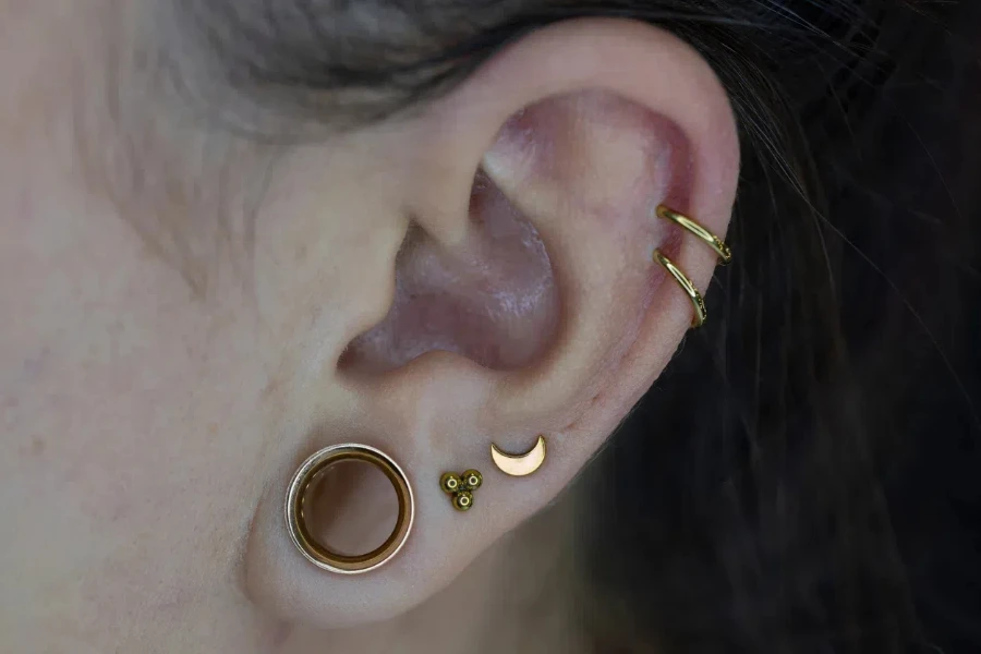 A woman with golden earrings