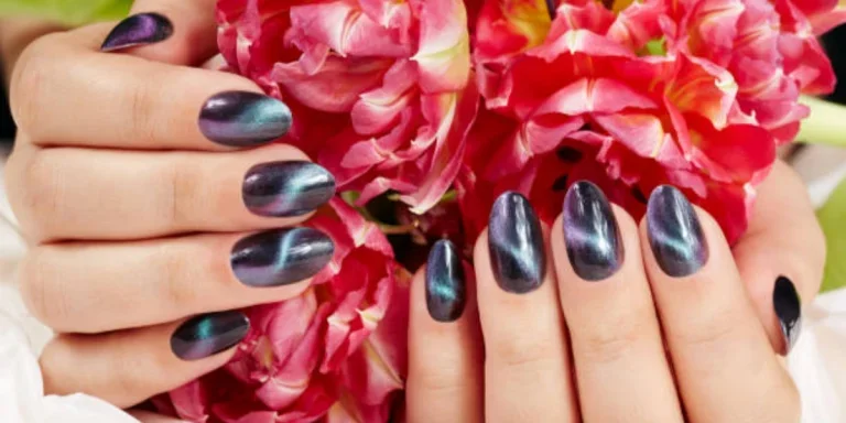 Female hands with modern cat eye nail art design